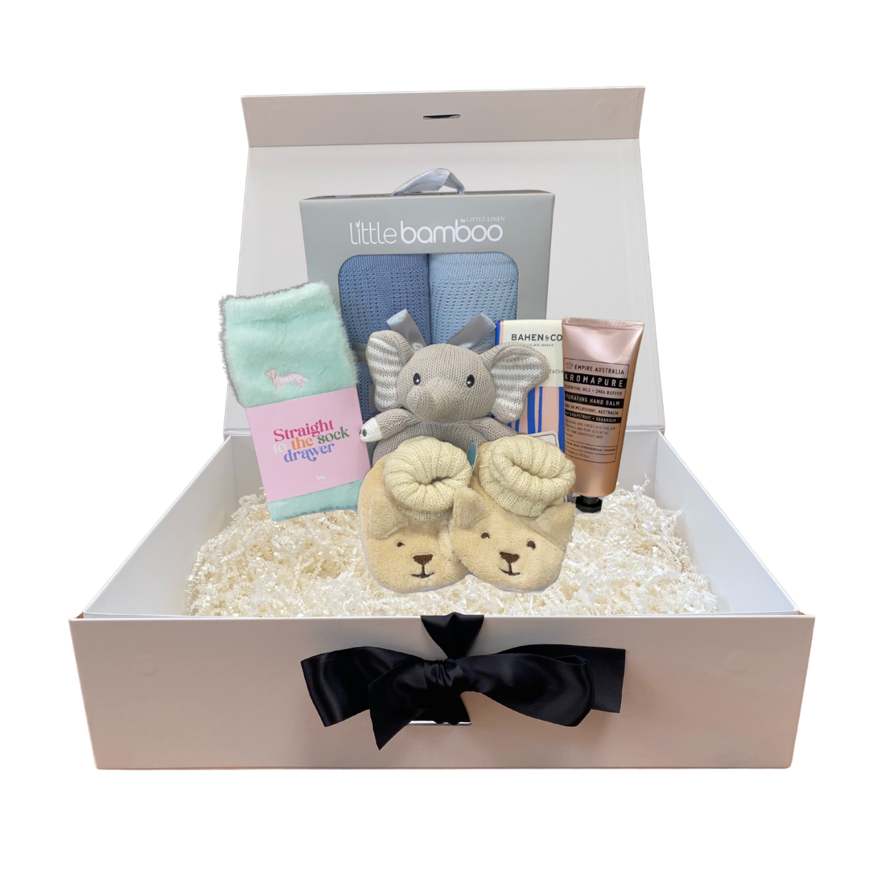 Baby boy gift set with items including socks, booties, and a toy in a box with 'Little Bamboo' branding.