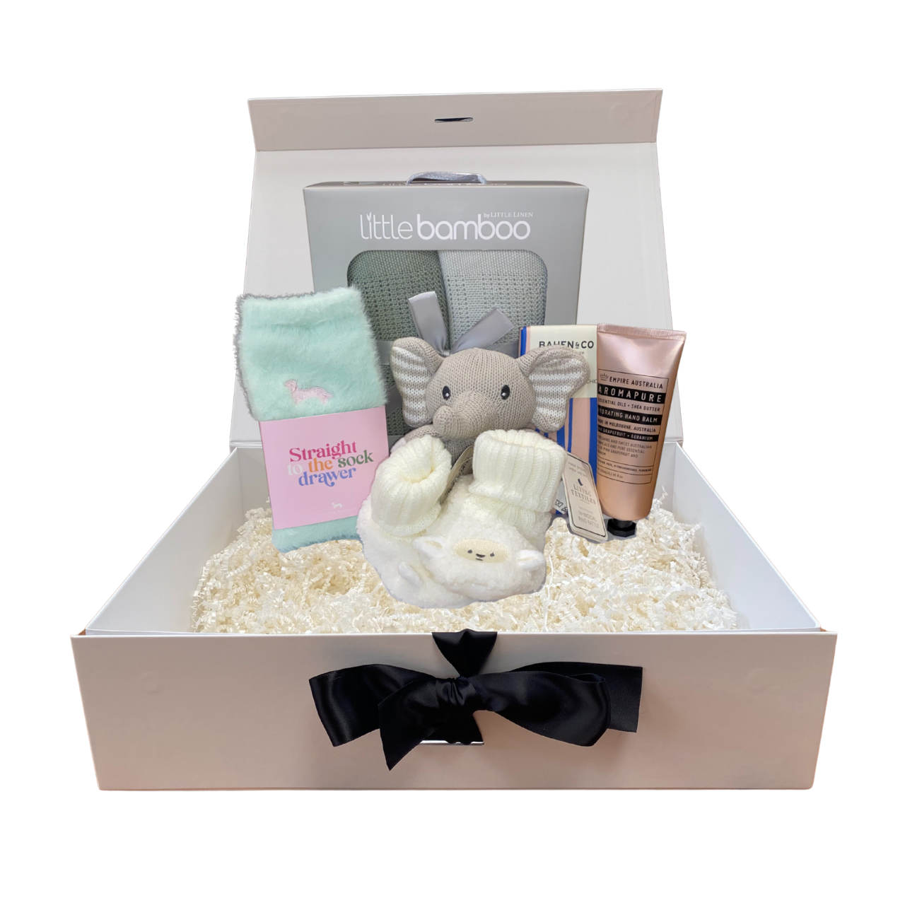 Baby gift box with baby items including a plush elephant, book, and lotion, branded 'little bamboo'.
