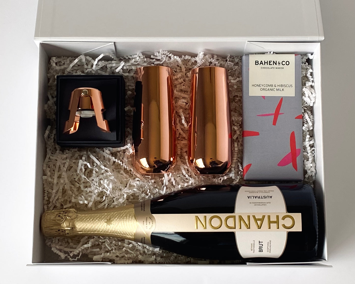 The Golden Toast - Chandon sparkling, copper flutes, stopper and artisan chocolate inside gift box, top-down view - Gift Bento