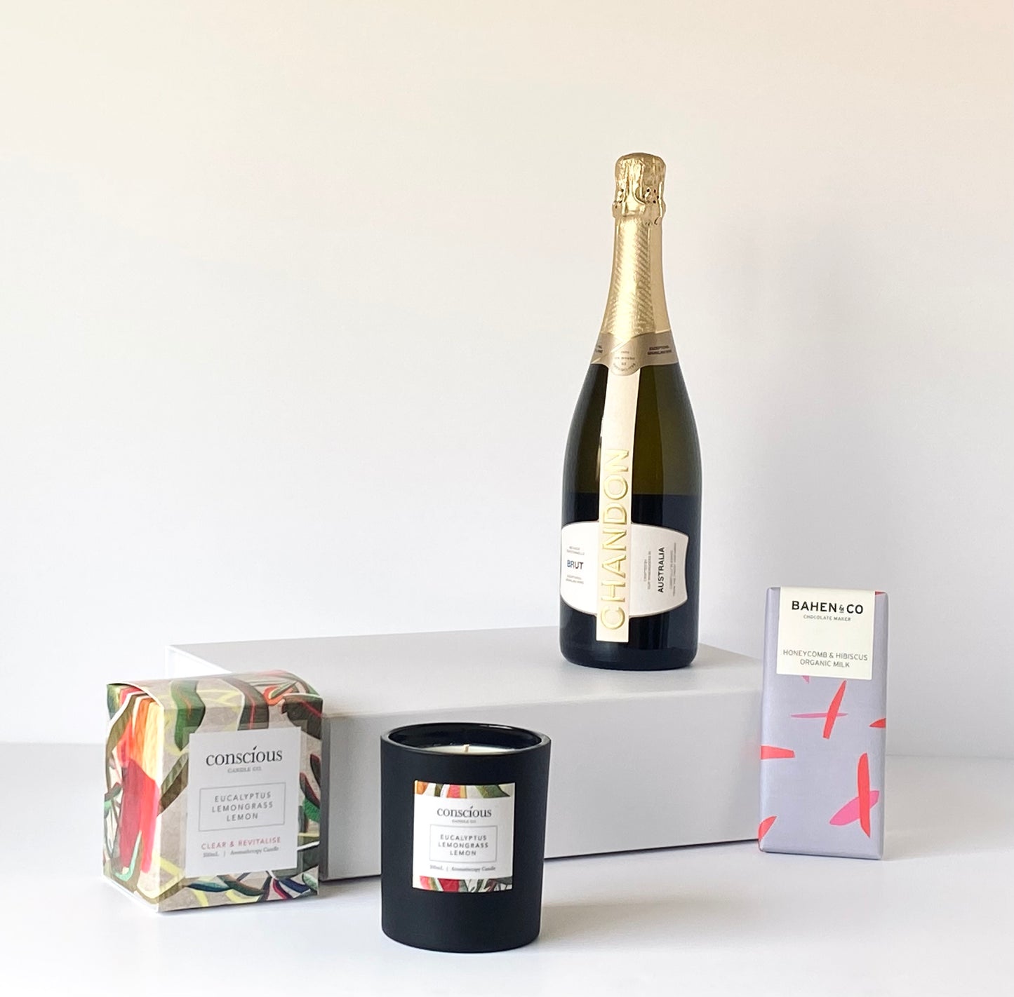 The Wine Lovers Indulgence - Chandon NV Brut Sparkling Wine on white magnetic gift box with candle and Bahen & Co chocolate - Gift Bento