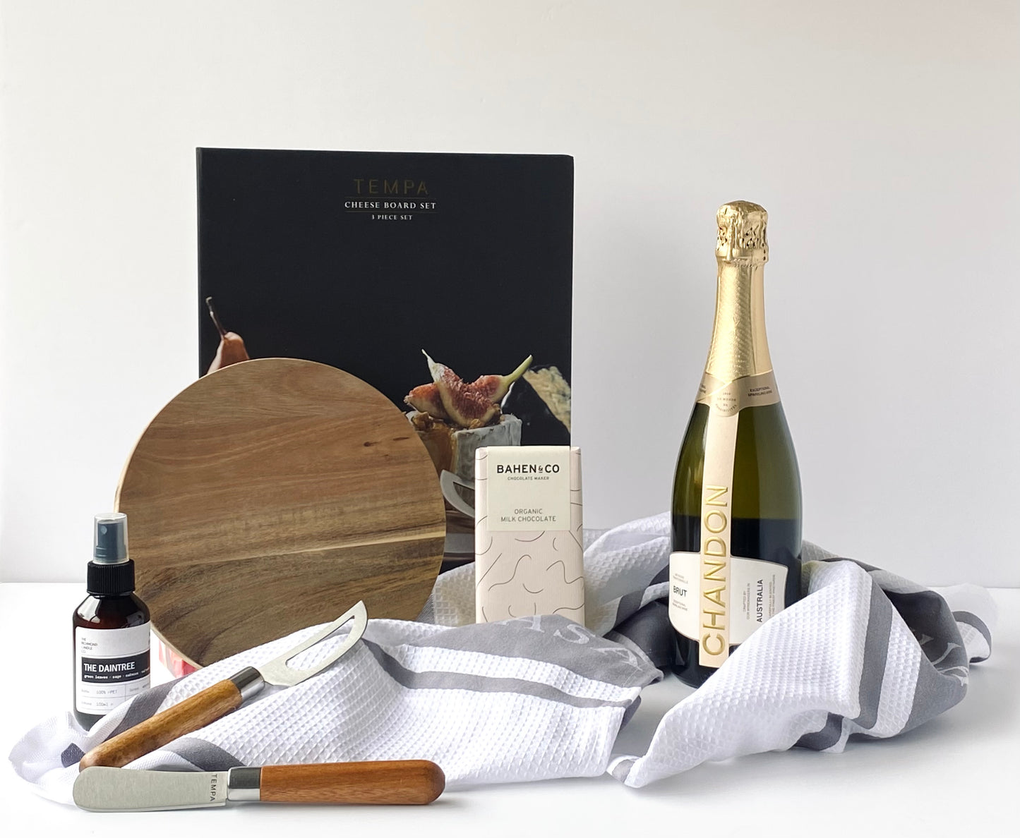Gather & Graze contents - Chandon NV Brut, Tempa Fromagerie 3-piece cheese set, Ladelle Bella Casa grey kitchen towels, Richmond Candle Co room spray and Bahen & Co chocolate - Gift Bento