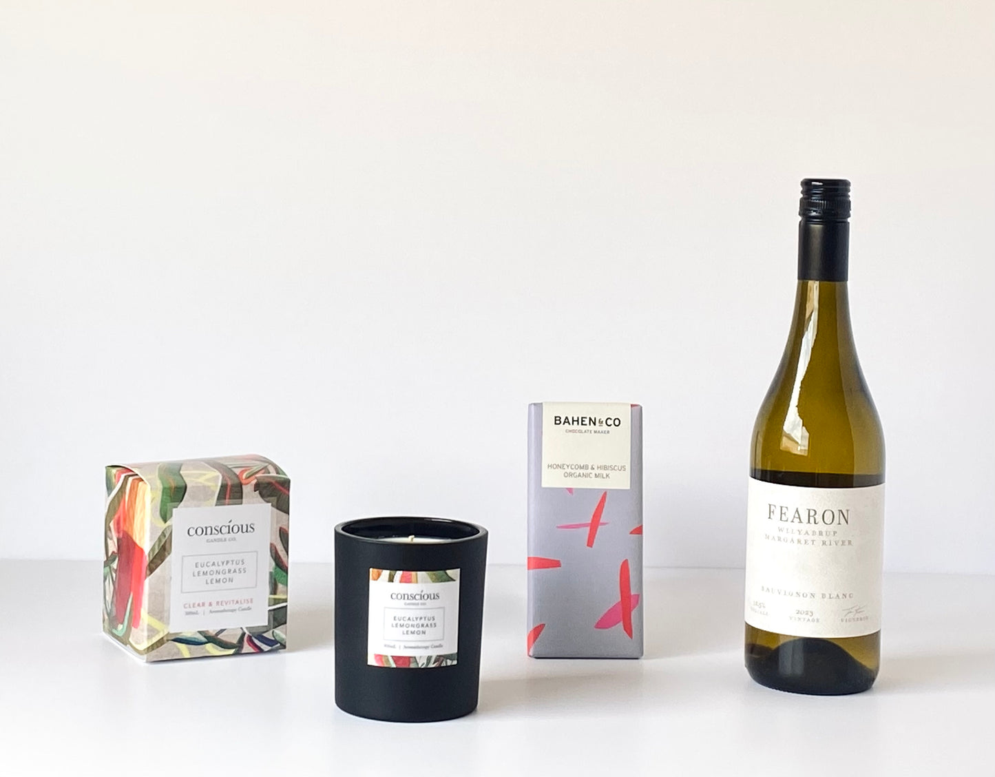 The Wine Lovers Indulgence contents - Fearon Wines Sauvignon Blanc, Conscious Candle Co aromatherapy candle and Bahen & Co chocolate block - Gift Bento